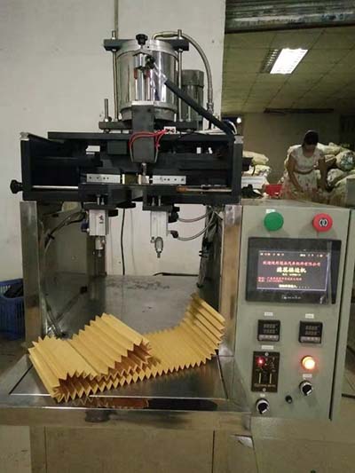 Paper core seaming machine